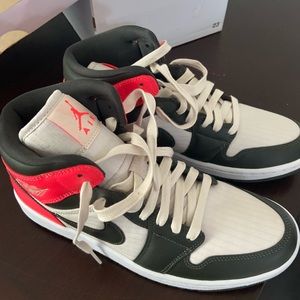Nike Air Jordan sneakers.  Women size 9.5 new in the original box.  NEVER WORN.
